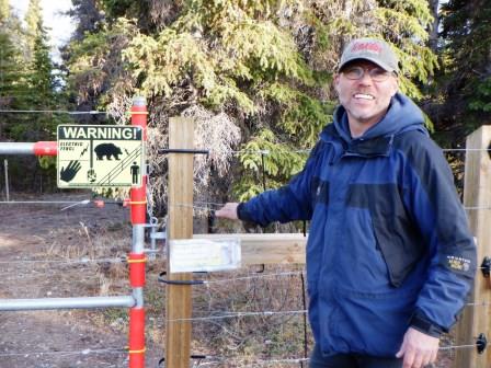 Pete touching the electric fence